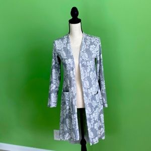 Knit jacket. Slight high/low hem